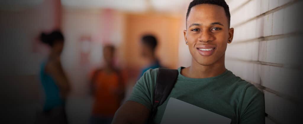 Young man leaning on a wall