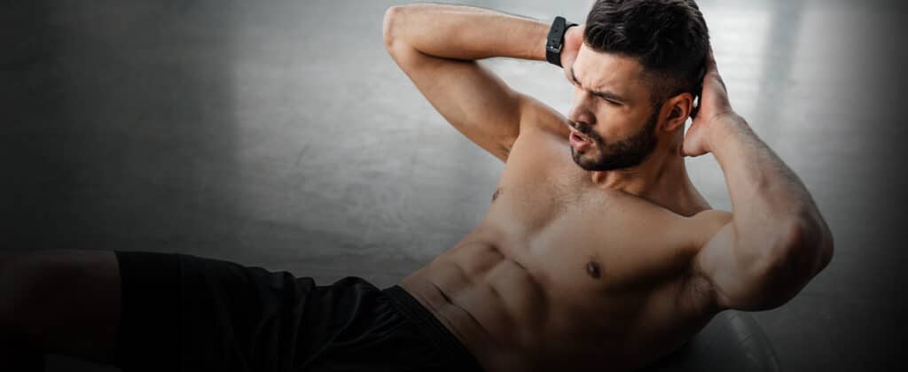 A man doing crunches on the floor