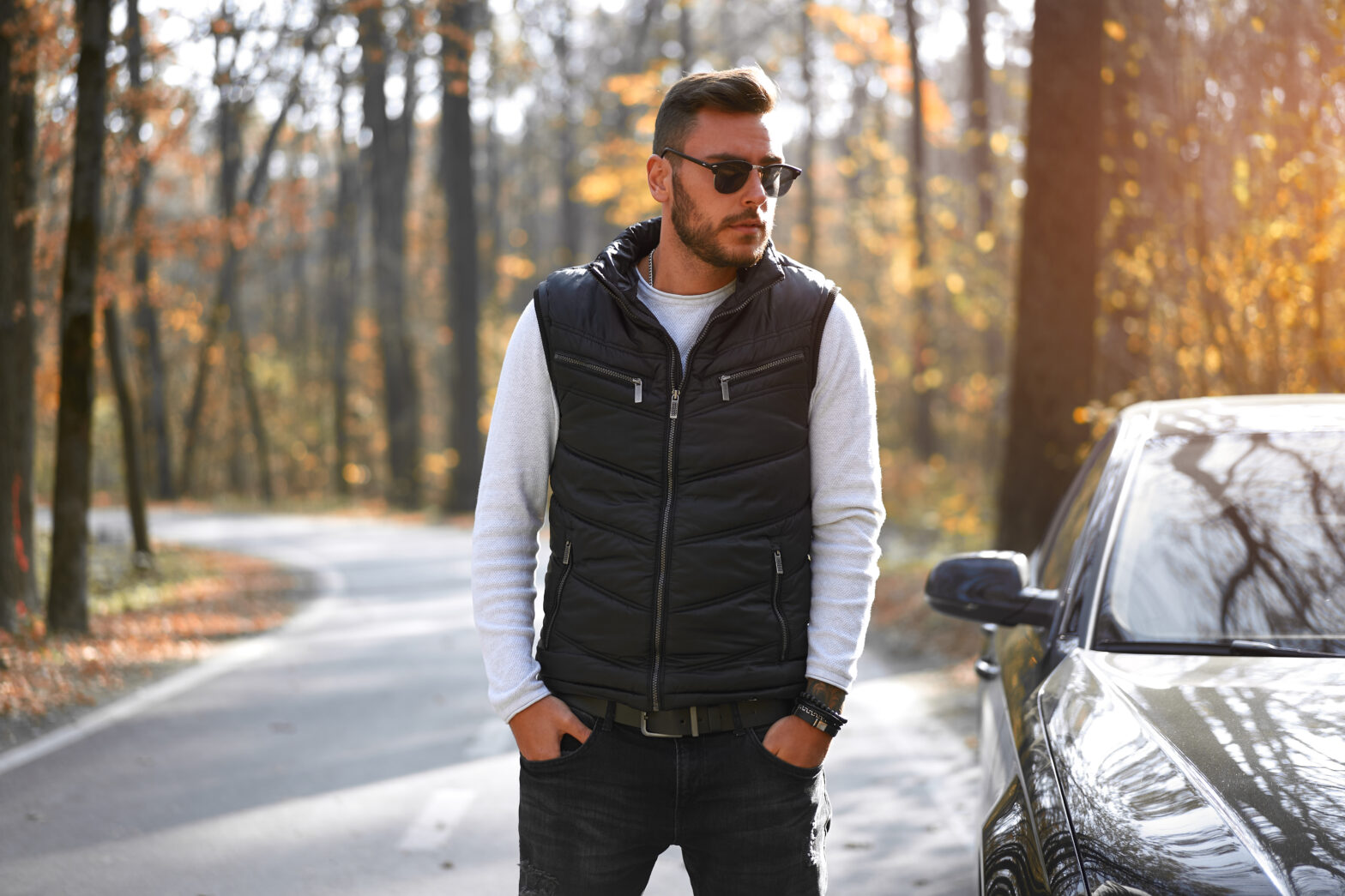 man in a vest in the fall