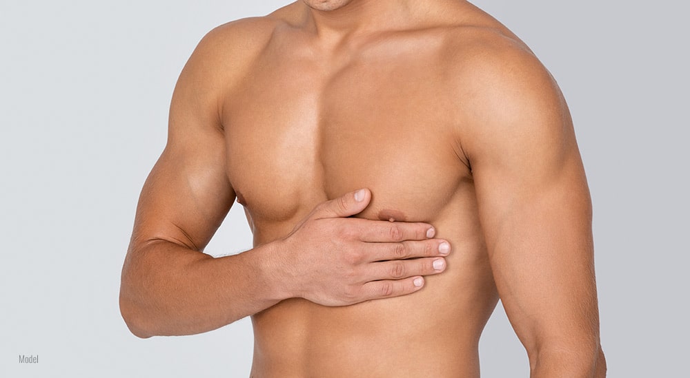 close-up of male chest in white background