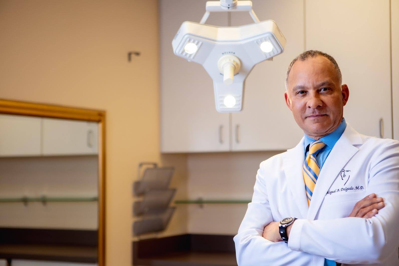 Dr Delgado standing in a medical office
